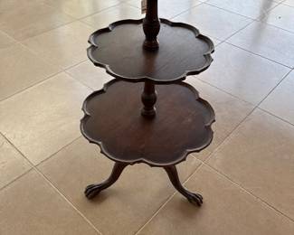 Antique imperial mahogany three tiered table claw