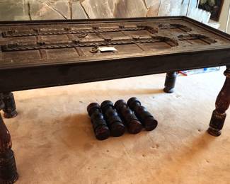 Beautiful carved table from India.  It can be converted to a coffee table with the additional legs. Glass top included.