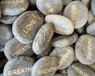 River rocks with inspirational words.  There are literally thousands of them at this sale!