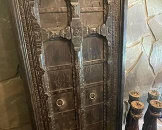 Antique Painted Door Table 35" X 72" X 30" (Possible purchased from Art of Old India, Inc.)  Two different sets of legs that screw into the table.  Can be used as an eating table or a coffee table.  Has large piece of glass that covers the table. 