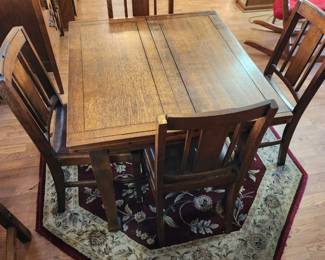 Table for 4 with matching chairs.  Both sides of the table fold out for more space.