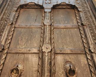 Antique Painted Door Table 35" X 72" X 30" (Possible purchased from Art of Old India, Inc.)  Two different sets of legs that screw into the table.  Can be used as an eating table or a coffee table.  Has large piece of glass that covers the table. 