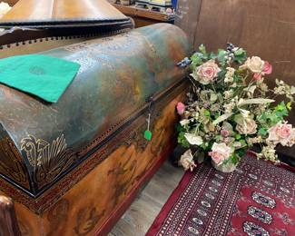 Round dome shaped hand painted chest and floral arrangements throughout shop