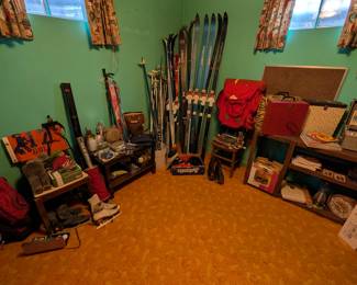 vintages skis and camping gear and vinyl record holders from the 80s with classic designs. 