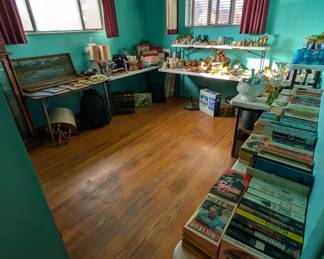 Room with books, glass wall decorations and more