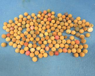 Lot 372. Clay marbles in an old Nestea jar