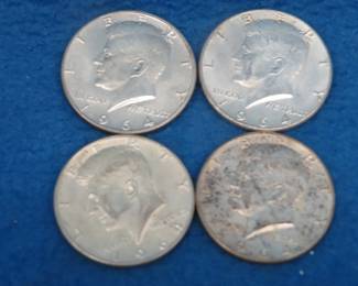 Lot 180. Four silver 1964 Kennedy Half Dollars