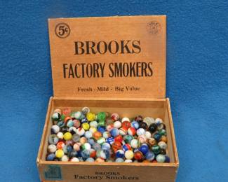Lot 59. Cigar box of marbles