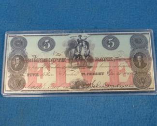 Lot 232. Four troy oz. of .999 silver in a reproduction $5 Monmouth Bank Note