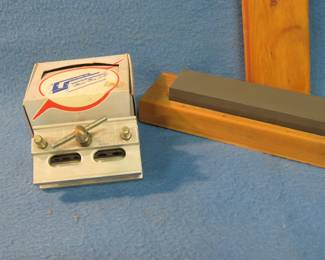 Lot 359. Dowl-It self-centering dowel. Drill guide model {#} 1000. Honing stone.