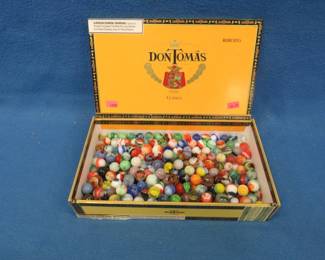 Lot 132. Marbles in a cigar box