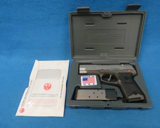 Lot 11. Ruger P90DC semi-auto 45. Ser. No. 661-85772. Includes two magazines, manual, and case.
