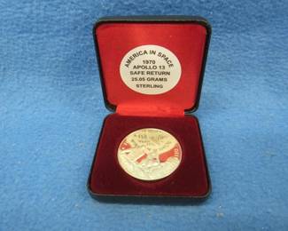 Lot 164. America in Space 1970 Apollo 13 sterling silver medallion. 25.05 grams. No sales tax on this item.