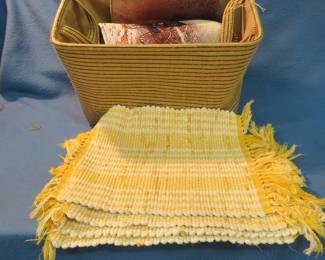 Lot 84. Placemats, rugs, and a storage basket