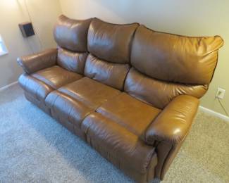 Lot 200. Double reclining leather 84" couch in excellent condition
