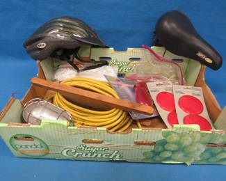 Lot 459. Heavy-duty trouble light, bike helmet and seat, and more