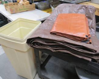 Lot 284. Two tarps (one is very large) and a garbage can