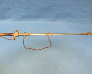 Lot 21. Sword and scabbard from the Knights of Pythias fraternal organization. Very good overall condition.