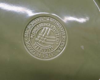 Lot 69. Longaberger green dishes and a metal bread tin