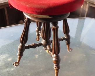 Lot 211. Claw foot glass ball piano stool. Works great