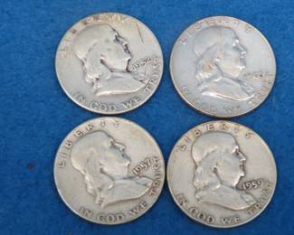 Lot 41. Four Franklin 90% silver half dollars