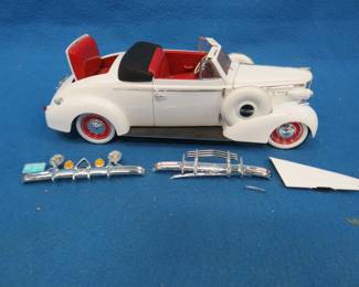 Lot 98. Signature Models 1938 Buick Century. 1:18 scale die-cast car. Some re-assembly is required.