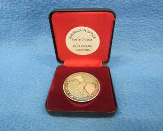 Lot 167. America in Space 1963 Faith 7 sterling silver medallion. 26.37 grams. No sales tax on this item.