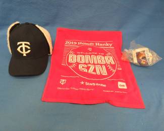 Lot 246. Minnesota Twins collectibles: 2011 Bert Blyleven HOF Day ball, 2019 Homer Hanky, Never-worn snap cap available only to season ticket holders.