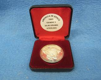 Lot 28. 1965 America in Space sterling silver medallion. 26.40 grams. No sales tax on this item.