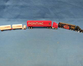 Lot 94. Die-cast Pontiac truck and two plastic trucks