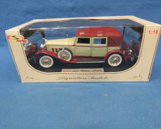 Lot 96. Signature Models 1930 Packard LeBaron. 1:18 scale die-cast car in original box. Appears to have never been out of the box.