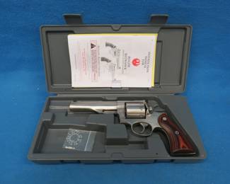 Lot 13. Ruger Red Hawk .357 Mag revolver. Ser. No. 504-06946. 5.5" barrel, 8 round-cylinder, 2 moon clips, manual, and case.