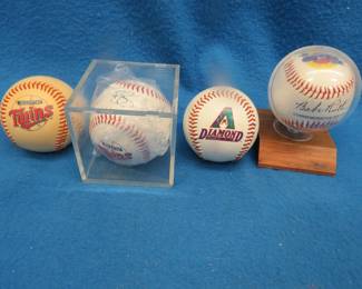 Lot 399. Four collectible baseballs: Minnesota Twins (unreadable autograph), Babe Ruth commemorative, Twins 1999 rookies, Diamondbacks