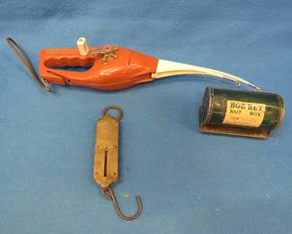 Lot 245. Brass scale dated 1892, Bob-Bet bait box, and a Popeil Pocket Fisherman for parts.