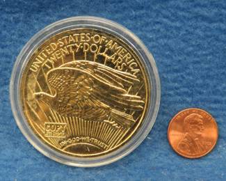 Lot 29. St. Gaudens $20 Double Eagle replica coin. Contains 2 ozs. (62.2 grams) of .999 silver with 24K ele