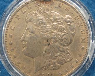 Lot 238. 1904 P Morgan silver dollar