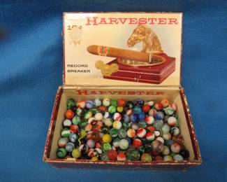 Lot 254. Marbles in an old cigar box