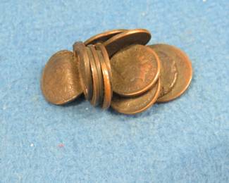 Lot 379. 12 Indian Head pennies and a 2-cent piece that have been fused together by an unknown event