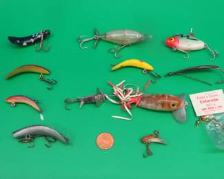 Lot 77. Ten baits including an unusual Jitterbug, metal spinner, and a tiny fly rod bait