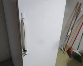 Lot 223. Frigidaire upright freezer 28"W x 60 1/2"H x 28 1/2"D with manual. Excellent condition