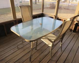 Lot 210. Patio table 60"W x 28"H x 38"D and two chairs