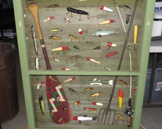 Lot 317. Fantastic shadowbox-style antique fishing lure display. Includes identification key. 36" x 7" x 47". Handmade by the consignor.