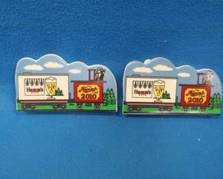 Lot 306. Pair of 2010 Hamm's Collectors Club commemoratives. Both have very faint surface scratches.