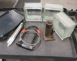 Lot 66. Glass window blocks, dolly, locking cable and more
