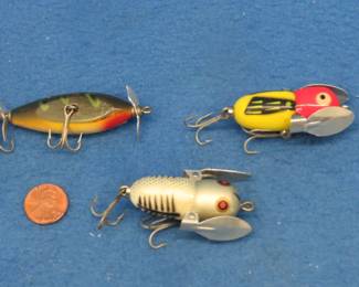 Lot 146. Two Heddon 1 3/4" Crazy Crawlers, and a CCBC 2" wooden Injured Minnow