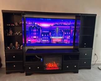 TELEVISION IS NOT FOR SALE! Entertainment cabinet(4) with fireplace is for sale.