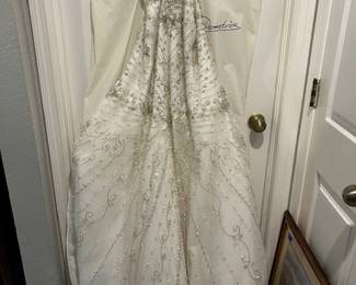 Demetrios Beaded wedding gown w/veil. Original cost $4500. Size 18, selling for much less.