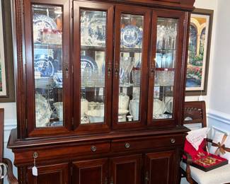 Lighted China cabinet in excellent condition $495. It is two piece. 87 inches high, 60 inches wide, 16 inches deep.