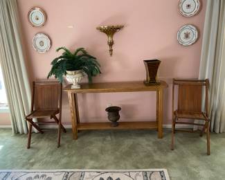 Table with decor, 2 nice vintage folding chairs, additional decor on walls