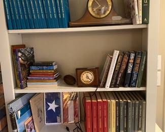 Books, collectible books , clock in bookcase across from kitchen
